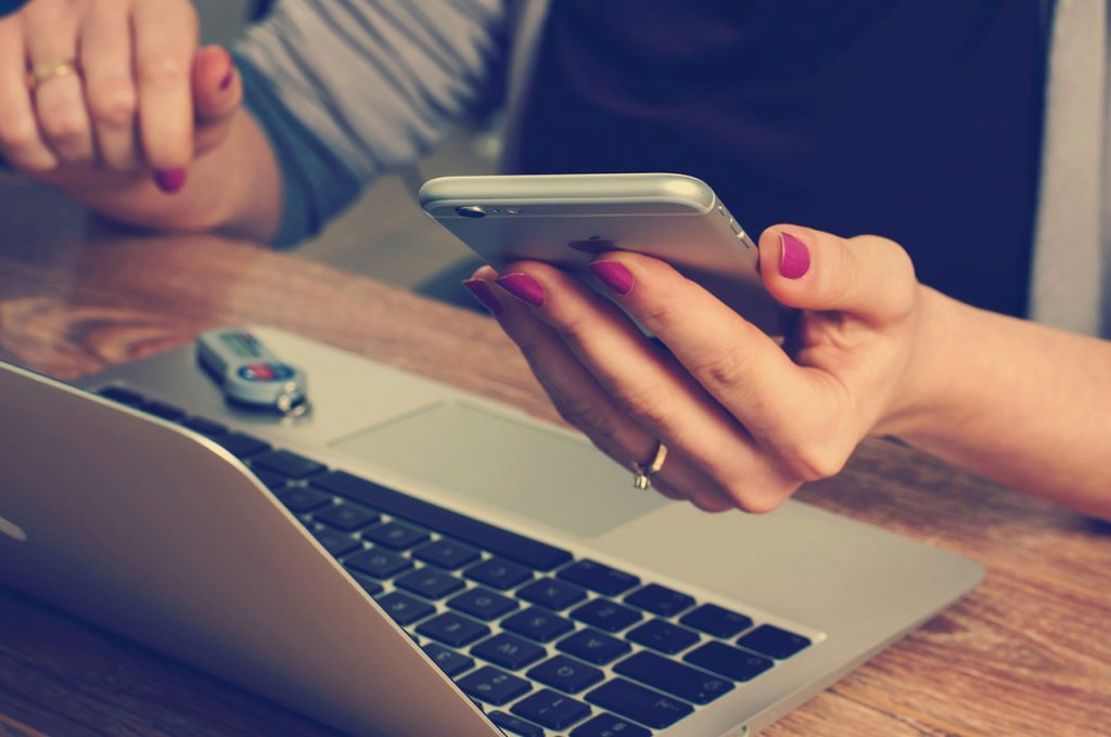 Woman receiving message from collections agent via social media