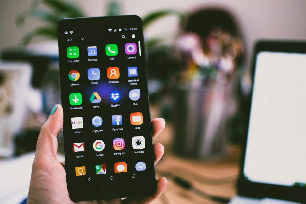 phone with many social media apps spokeo for business asset recovery