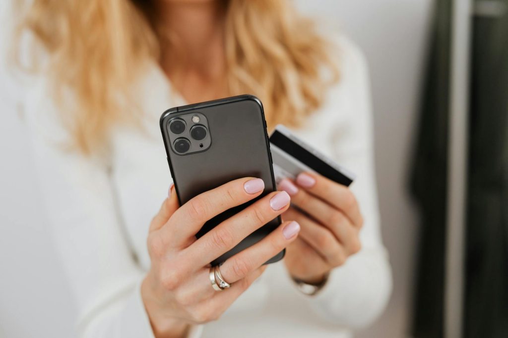 woman shopping on smartphone understanding BNPL debt