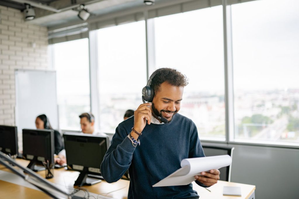 smiling male collections agent using effective collections script