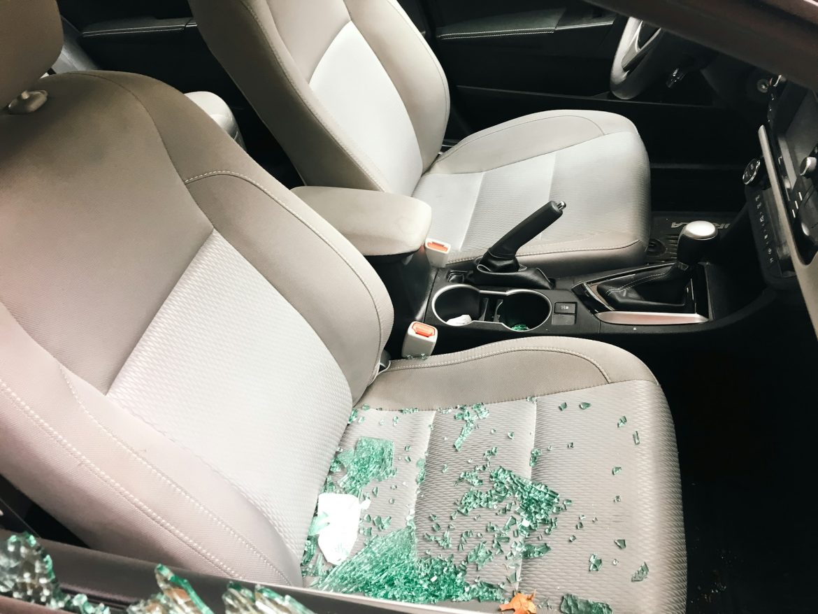 zoshua-colah-7_QYmZmcMcM-unsplash Car window shattered into seats after property crime was committed
