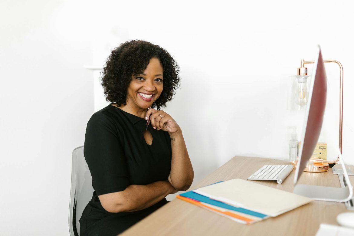 B2C saleswoman feeling happy about leads she got more information on through contact enrichment tools