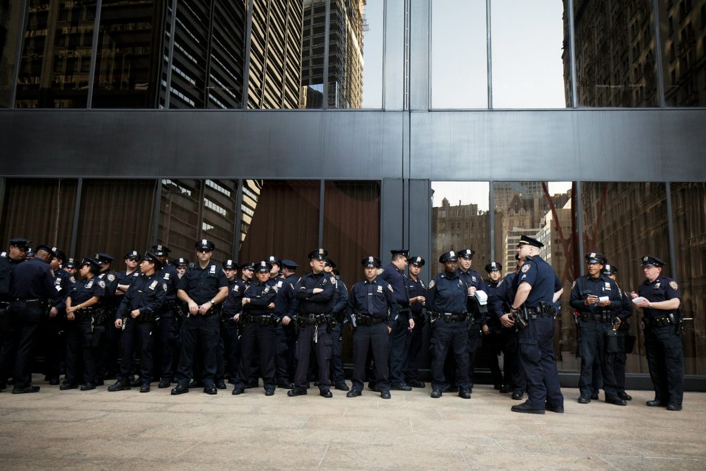 group of police standing outside being briefed on an investigation shaped by 2026 law enforcement trends