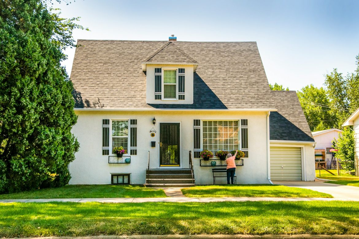 strategies for window and door. lead generation old woman out front of cottage style home