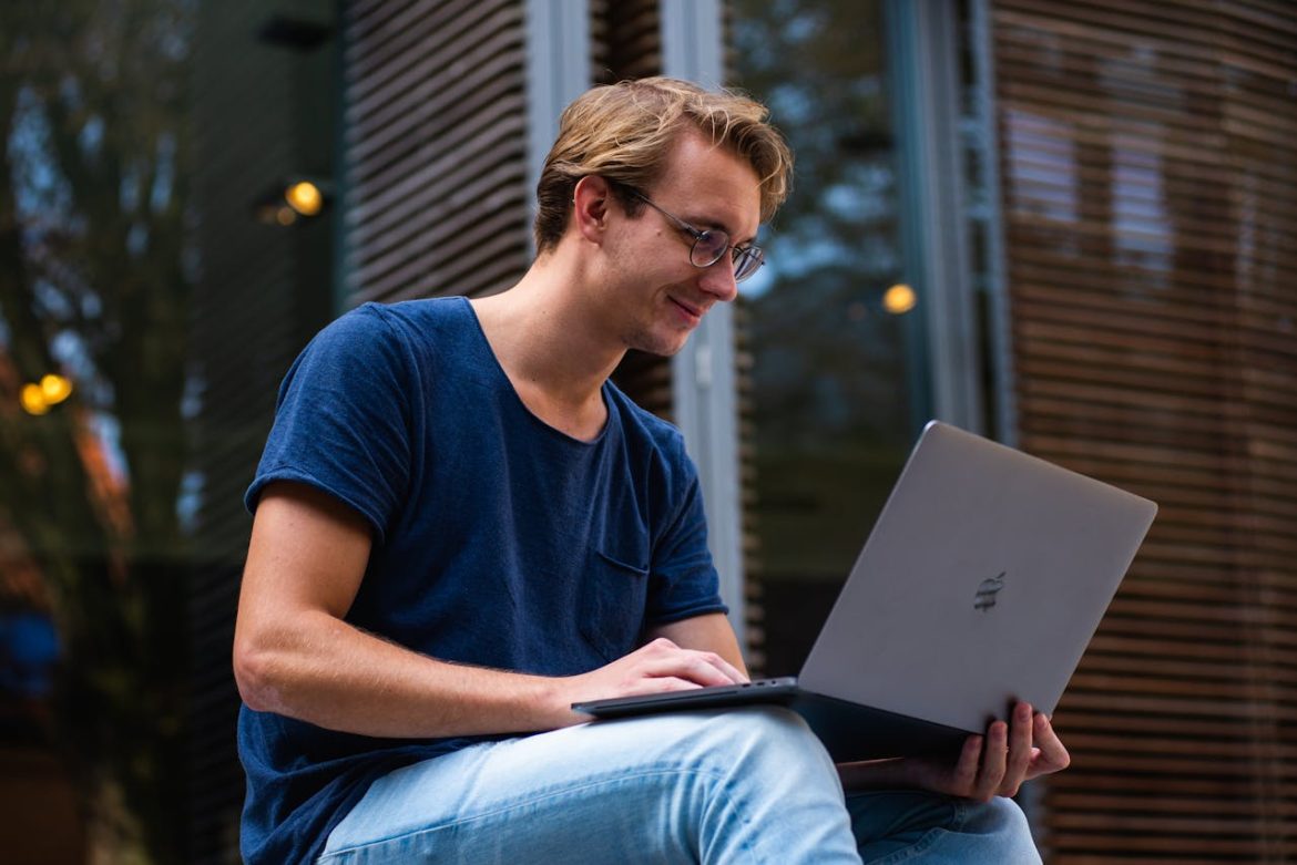 man using AI tools to enhance digital marketing for window and door companies